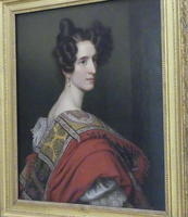 Woman with parted, pointy hair