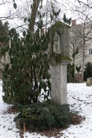 Grave marker with tree and bushes