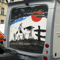Goats under red moon (painted on back of RV)