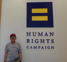 Me in front of Human Rights Campaign headquarters logo.
