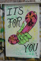 Green hand with orange nails holding phone receiver: “It's for you”