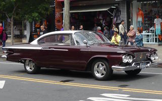 Maroon clasic car with white roof