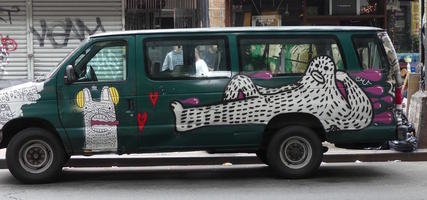 Van with cartoon yeti on side