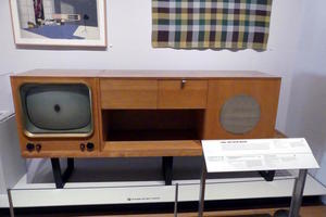 TV and stereo in wooden cabinet circa 1960s