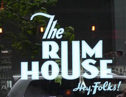 Logo for the Rum House; the U is shared between both words