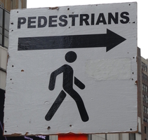 “Pedestrians” sign with silhouette of a person walking