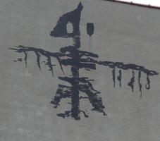 Skeletal bird painted on building wall