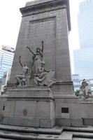 Monument to war dead; central figure with arms upraised