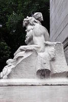 Side view of statue of reclining man