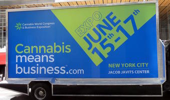 Advert on side of truck: Cannabis means business.com Expo June 15-17