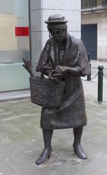 statue lady with shopping bag