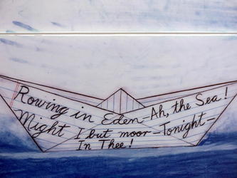 Paper boat with words on it: "Rowing in Eden - Ah, the Sea! Might I but moor - Tonight - In Thee.