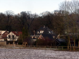 Older houses on banks of a river