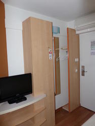 Room showing closets and shelves (instead of drawers).