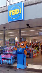 TEDi (childrens' articles) storefront with large teddy bear cutout