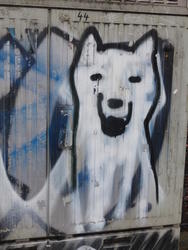 Smiling husky dog painted on side of utility box