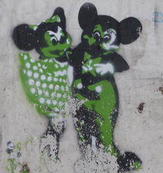 Dancing green Mickey and Minnie Mouse painted on side of utility box.