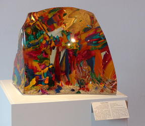 Multicolored glass shaped like large semi-rectangular stone