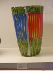 Glass with orange, blue, and green stripes.