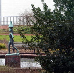 Statue of woman carrying water jar on head
