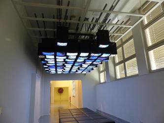 Long view showing TVs mounted on ceiling