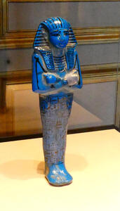 small blue egyptian statuette