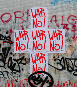 Posters in form of a plus sign; all posters say “War No!”