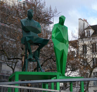 seated standing angular sculptures in green