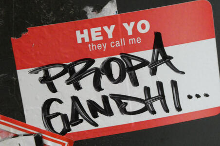 Name sticker: pre-printed Hey Yo they call me; written Propa Gandhi