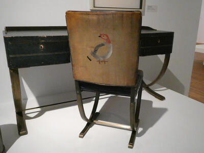 chair with bird painted on back