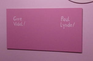 Purple rectangle; at left “Gore Vidal!”; at right “Paul Lynde!”