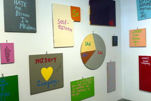 Various posters: self-esteem 5 cents / misery loves company/LOSER line forms here