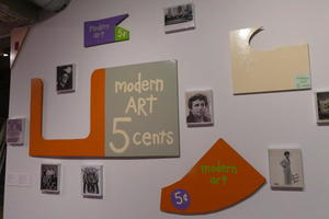 Multiple oddly-shaped posters labeled “Modern art 5 cents”