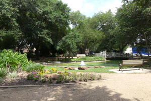 park with fountain and small bridge