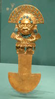 Gold knife with man in headdress as handle