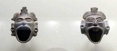 Jars in form of human heads with wide-open mouths