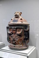 Large urn with dog-like creature at top