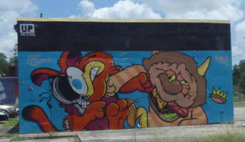 Wall painting of two cartoonish figures punching each other