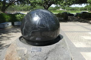Large black sphere with map of earth
