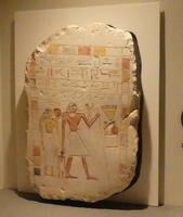 Egyptian stele with man and woman, heiroglyphs above