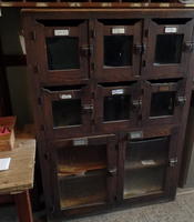 Old wooden mailboxes with glass window insets