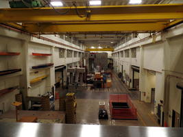 Long view of equipment bay with yellow metal beams at top