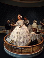 Mrs. Lincoln wearing white flowered dress