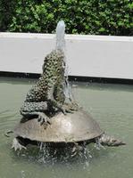 Fountain in shape of a frog sitting on the back of a turtle