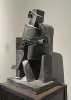 Cubist sculpture of man playing guitar