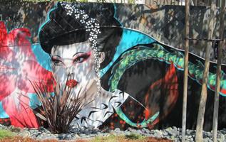 mural: lotus blossom, geisha head, tail of dragon