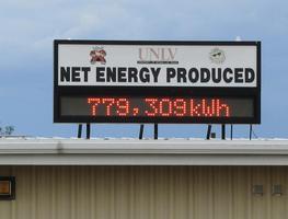 Sign showing 779,309 kwh net energy produced from solar power station