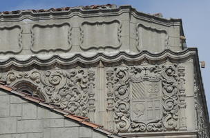 Ornate relief/scrollwork on building.
