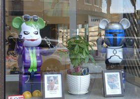 Store window with Joker and a Robot with Mickey Mouse ears