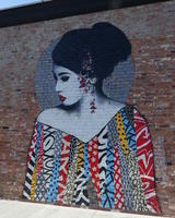 Wall painting of woman wearing multi-colored dress